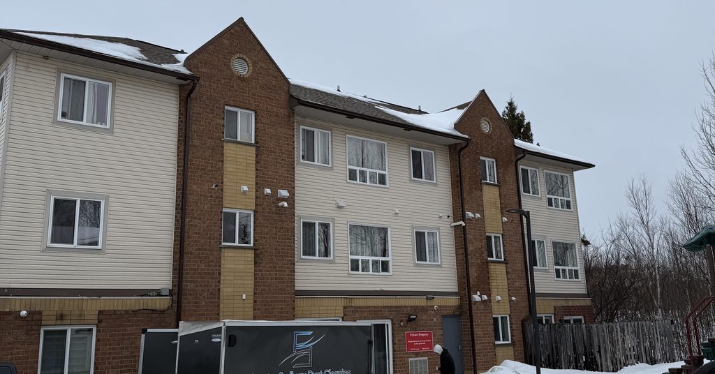 Greater Sudbury Duct Cleaning trailer at a Sudbury apartment complex in winter