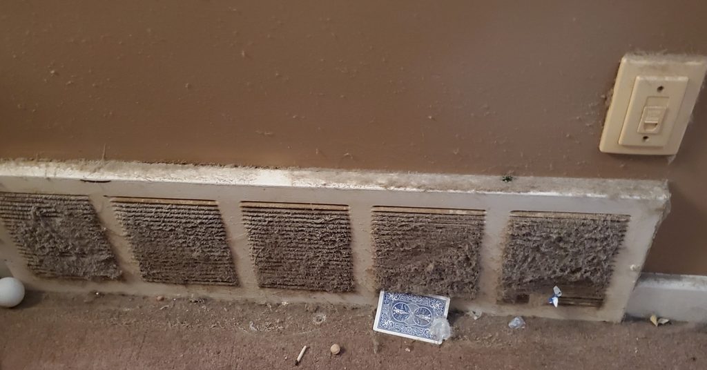 Dust-clogged return air grille found in a Sudbury home before duct cleaning