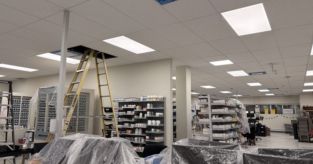 Greater Sudbury Duct Cleaning crew accessing ceiling ductwork at a Sudbury business