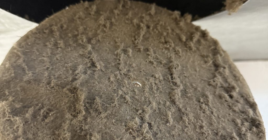 Dust-caked vent cap removed during a Greater Sudbury Duct Cleaning job