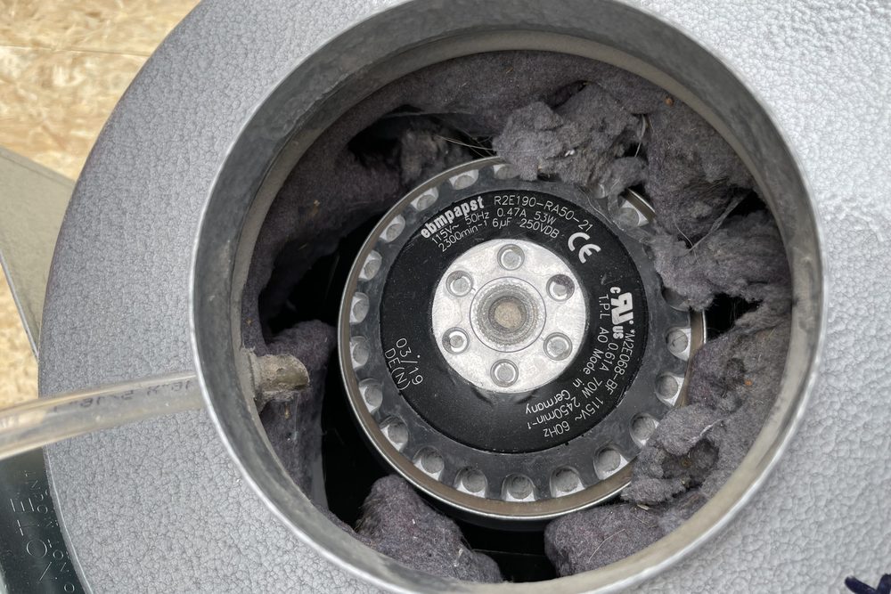 Exhaust fan wheel packed with lint before cleaning by Greater Sudbury Duct Cleaning