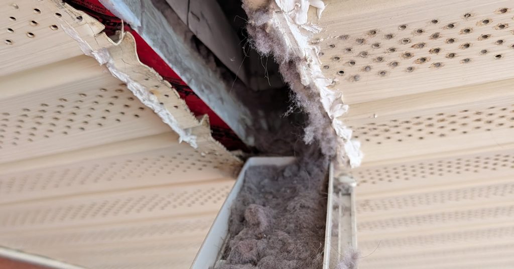Soffit dryer vent clogged with lint uncovered by Greater Sudbury Duct Cleaning