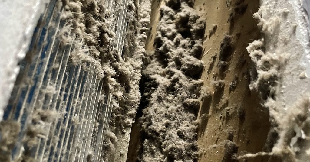 Inside of a supply duct packed with dust before cleaning in Greater Sudbury