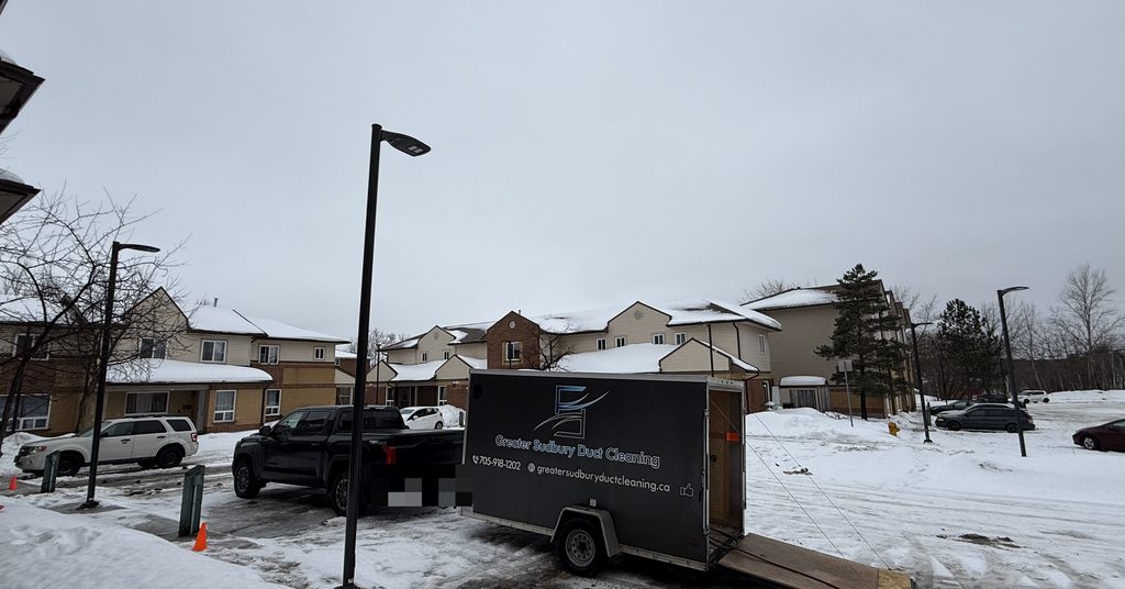 Greater Sudbury Duct Cleaning truck and trailer at a Sudbury townhouse complex