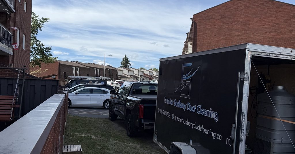 Greater Sudbury Duct Cleaning truck and trailer at a residential building in Sudbury